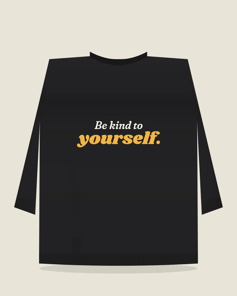 Black crewneck sweatshirt with the print “Be kind to yourself.”, back view (illustration)