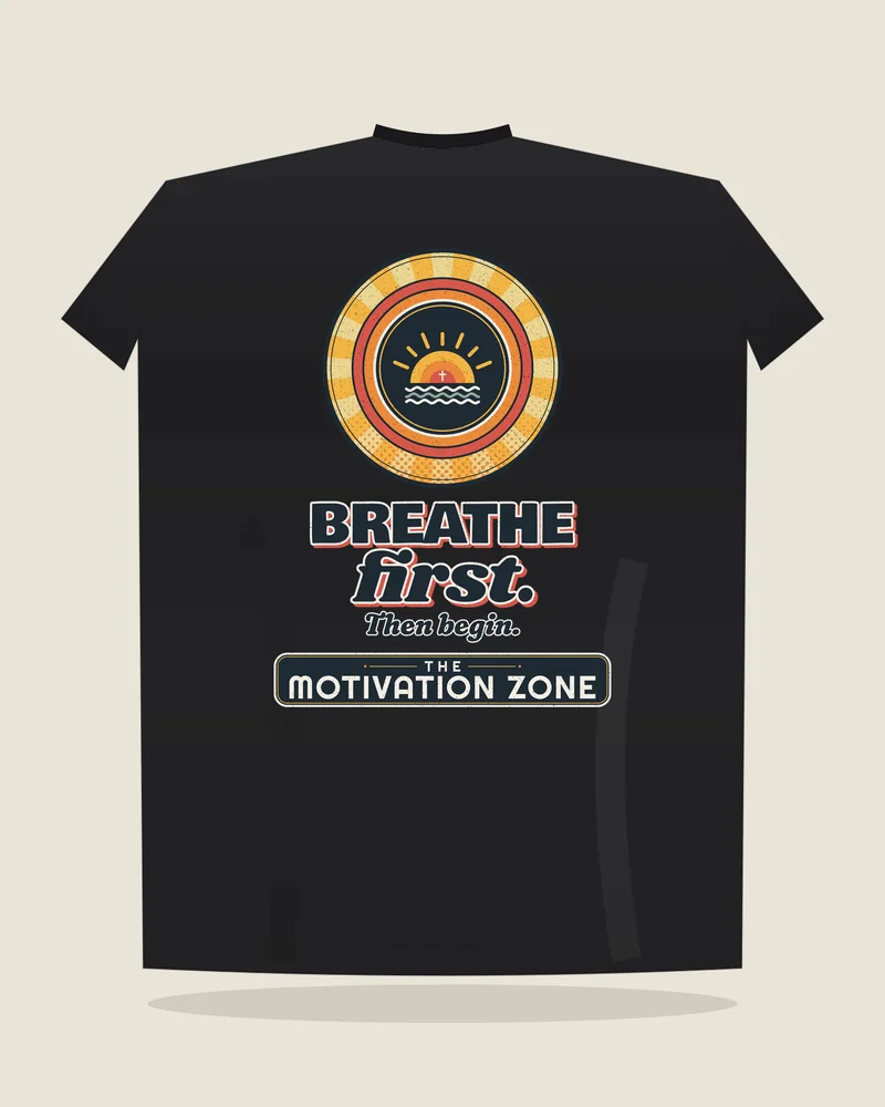 Black tee with the print “Breathe first.”, back view (illustration)