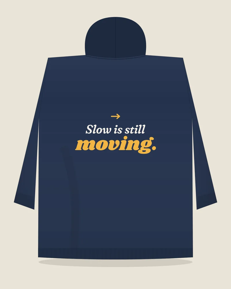 Navy hoodie with the print “Slow is still moving.”, back view (illustration)