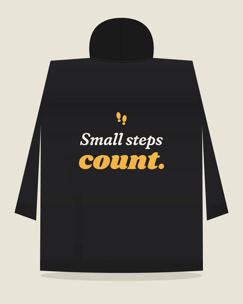 Black hoodie with the print “Small steps count.”, back view (illustration)