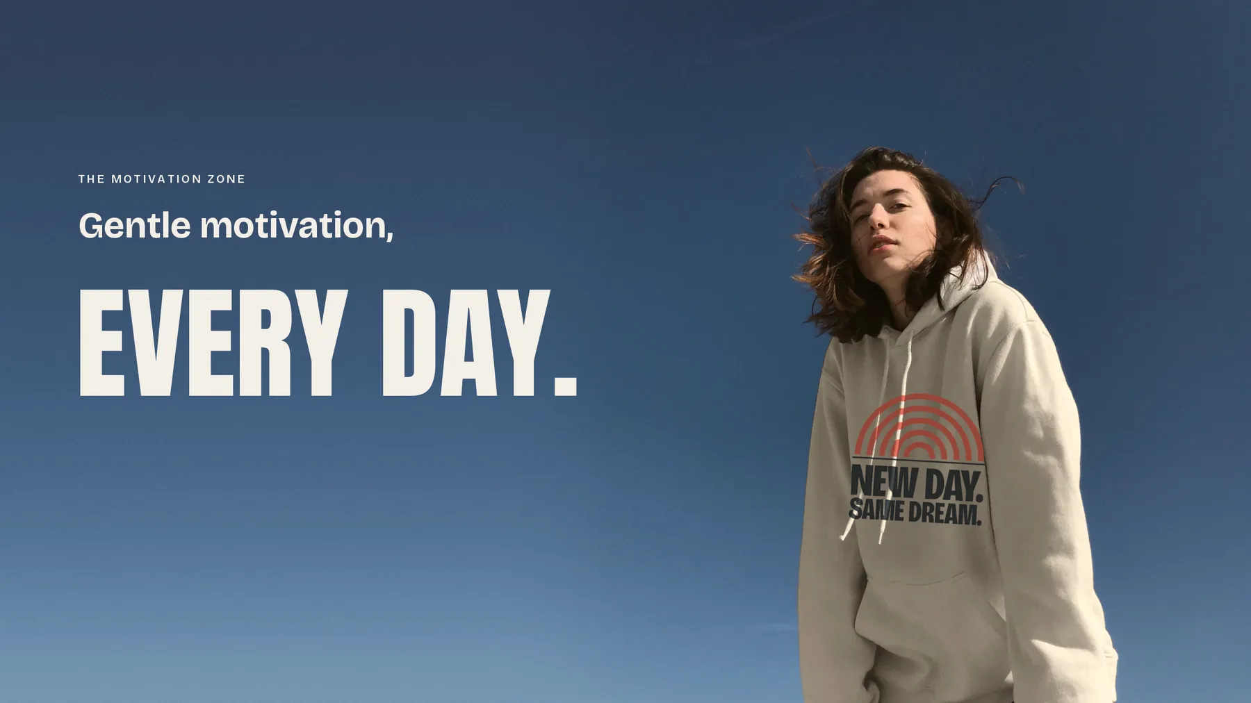 A person in an oat-colored hoodie against a deep blue sky. Words on the picture: The Motivation Zone. Gentle motivation, every day.